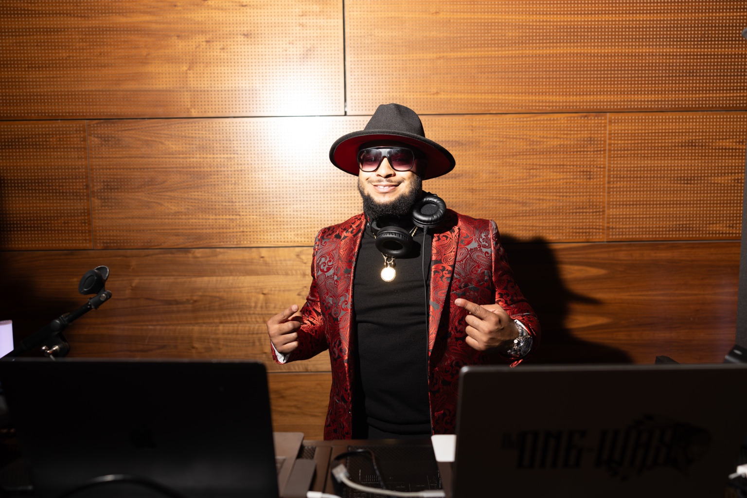DJ One-Way in a red formal jacket